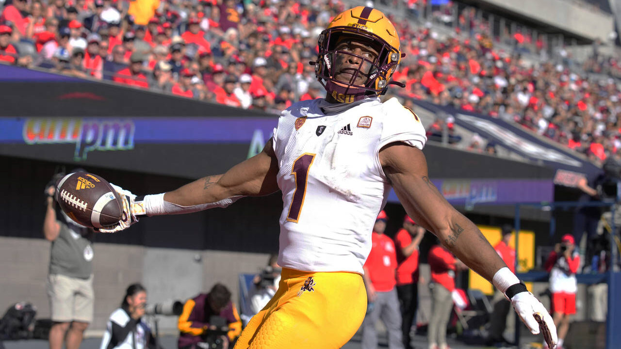 Arizona State running back Xazavian Valladay reacts after scoring a touchdown against Arizona in th...