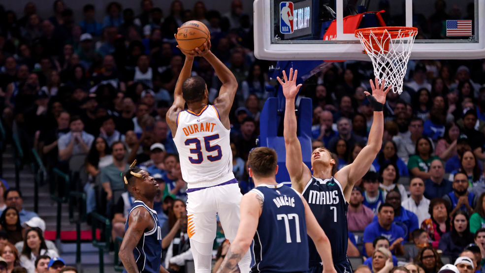 Kevin Durant #35 of the Phoenix Suns scores a basket against the Dallas Mavericks in the first half...