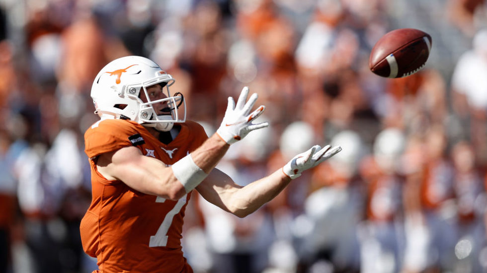 Jake Smith #7 of the Texas Longhorns catches a pass for a touchdown in the third quarter against th...