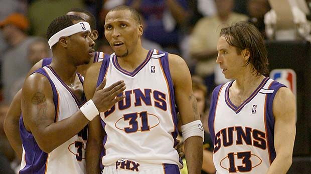Quentin Richardson #3 and Steve Nash #13 of the Phoenix Suns encourage Shawn Marion #31 after Mario...